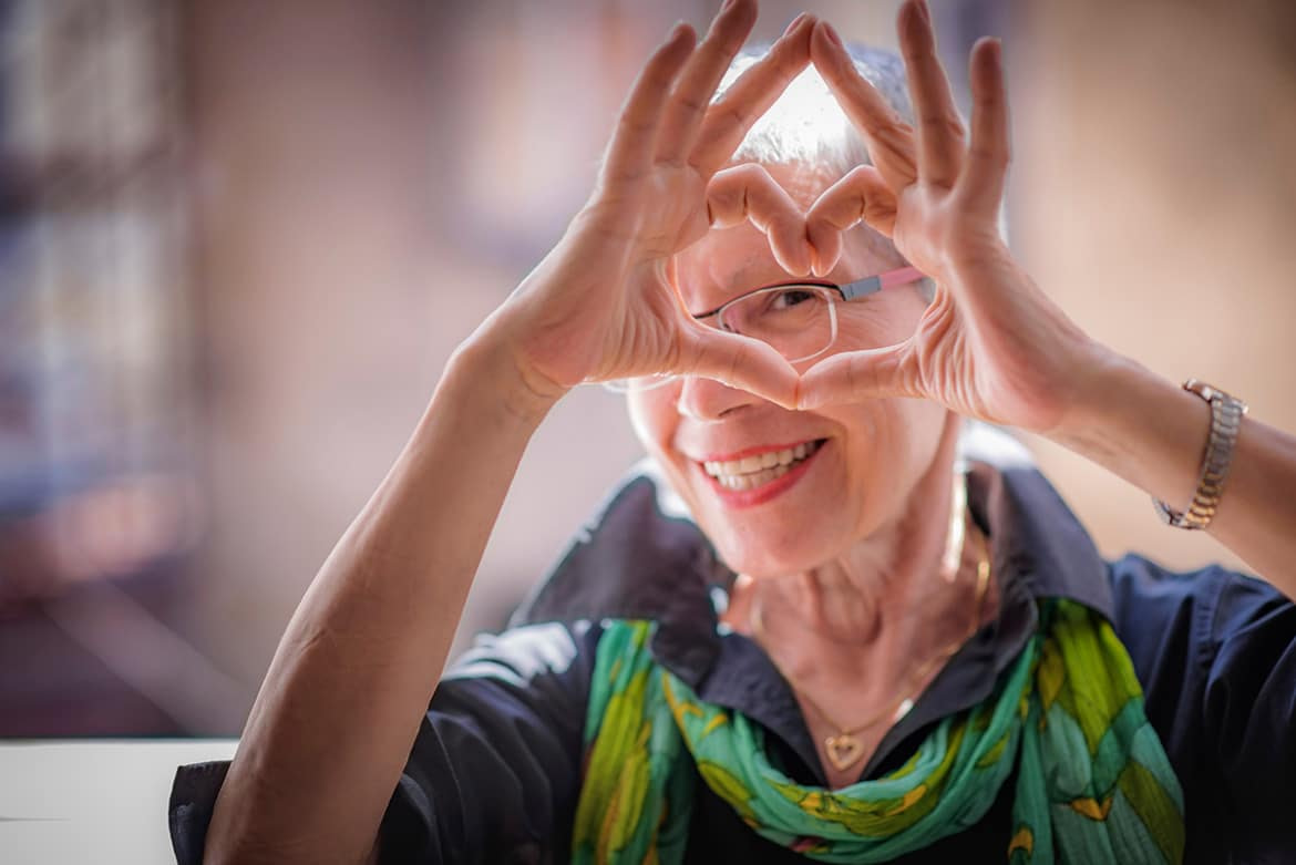 Happy woman making a heart