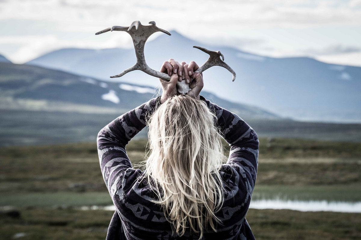 Nordic woman holding antlers