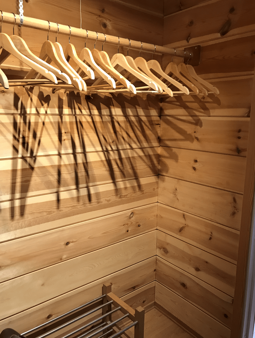 Empty wardrobe with hangers Capsule wardrobe